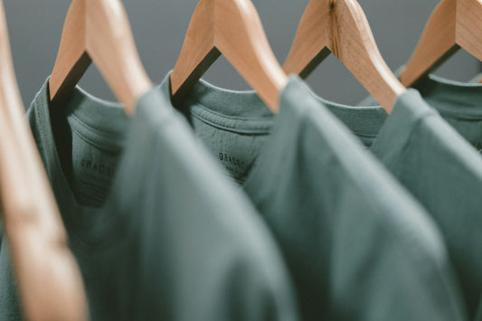 Stack of neatly folded natural fiber clothing for sustainable fashion in Pakistan